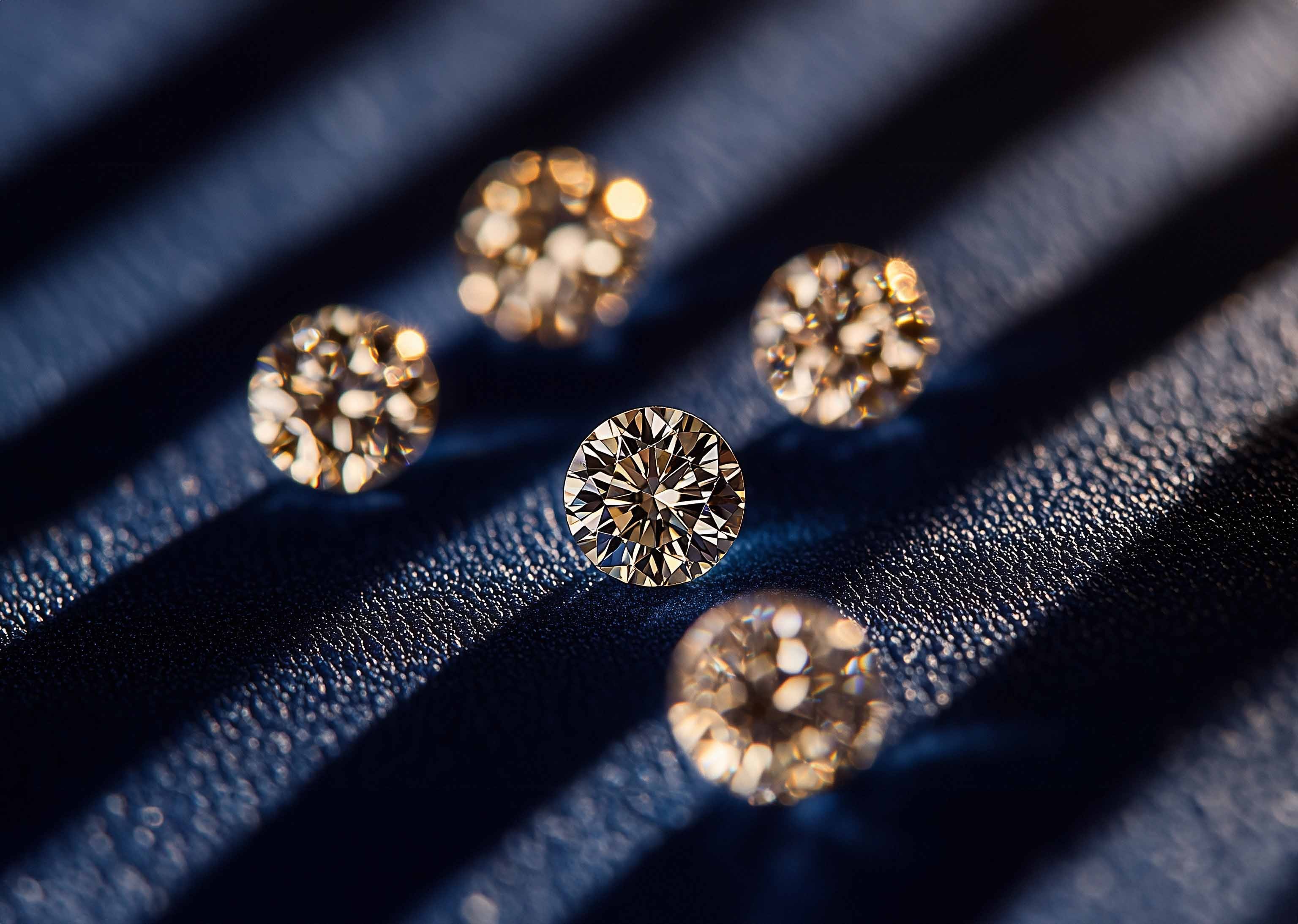 Round diamonds on blue surface