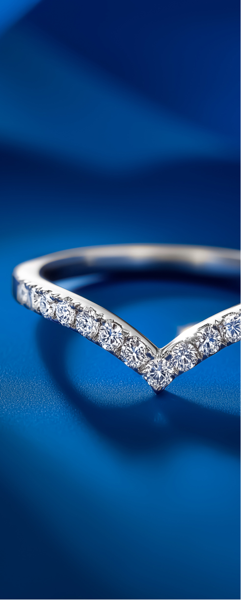 Vintage wedding band in white gold on blue cloth.