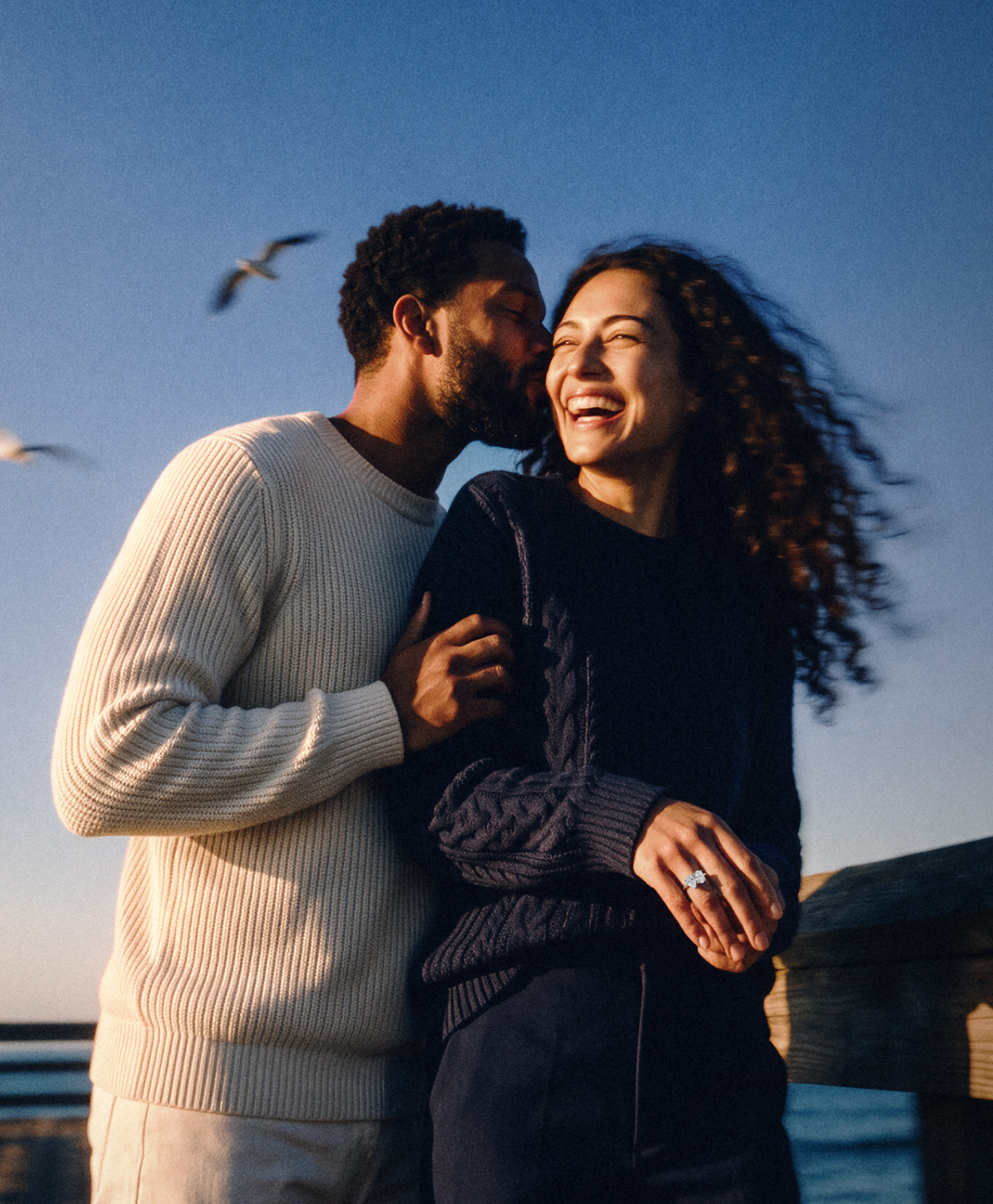 Couple on a pier at golden hour