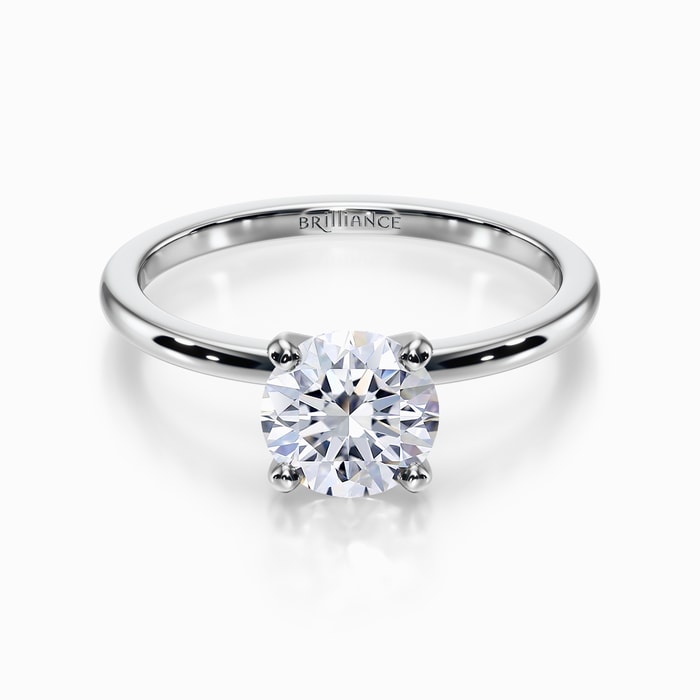 Dainty Solitaire Engagement Ring in Platinum