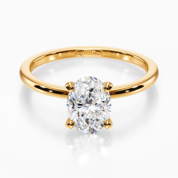 Dainty Solitaire Engagement Ring in Yellow Gold