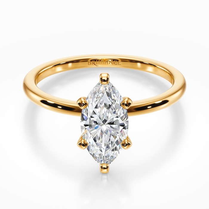 Dainty Solitaire Engagement Ring in Yellow Gold