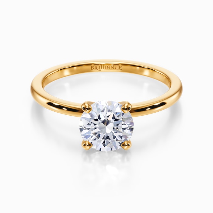 Dainty Solitaire Engagement Ring in Yellow Gold