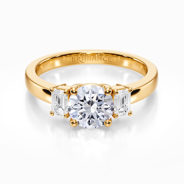 Three Stone Emerald Cut Diamond Ring in Yellow Gold