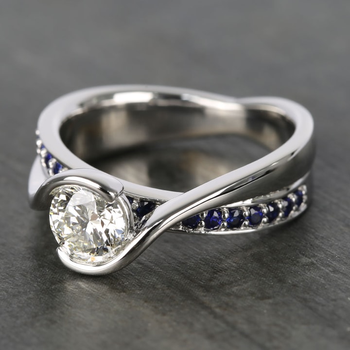 Sapphire And Diamond Bezel Set Bridge Engagement Ring