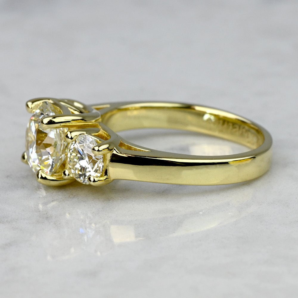 2 Carat Round Three Stone Engagement Ring in Yellow Gold angle 2