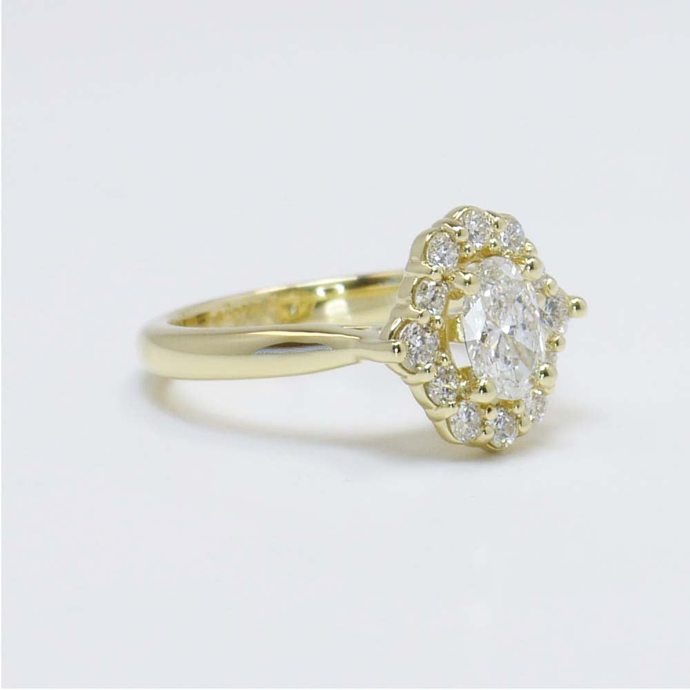 0.60 Carat Oval Diamond Ring With Halo In Gold  angle 3