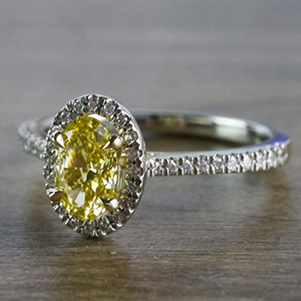 Intense Fancy Oval Yellow Diamond Ring In A Diamond Halo angle 2