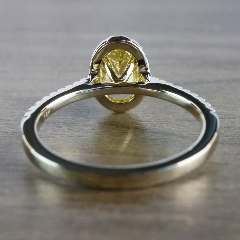 Intense Fancy Oval Yellow Diamond Ring In A Diamond Halo angle 4