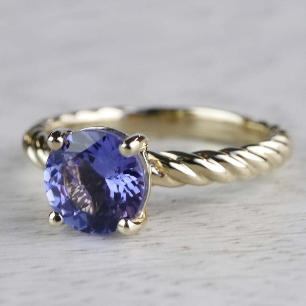 Stunning Blue Tanzanite Engagement Ring In Yellow Gold angle 2