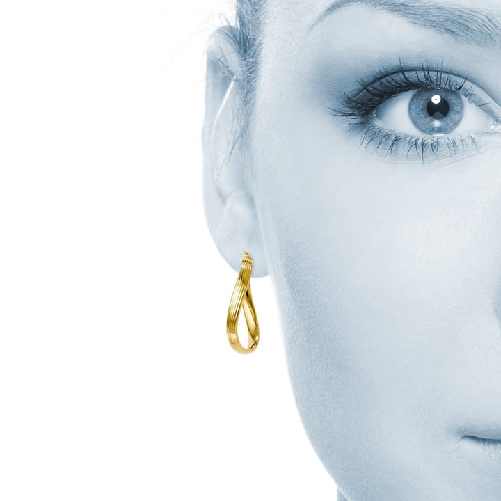 Twisted Oval Hoop Earrings In Yellow Gold | Thumbnail 01