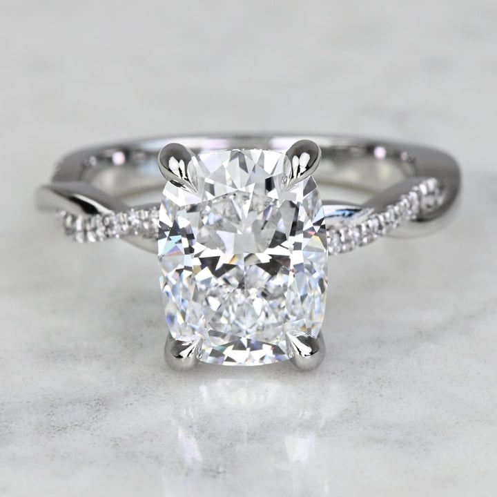 https://www.brilliance.com/cdn-cgi/image/width=720,height=720,quality=85/sites/default/files/recently-purchased-rings/3-carat-lab-grown-elongated-cushion-diamond-twisted-band-engagement-ring/331228-3ct-cushion-twisted-band-er-1.jpg