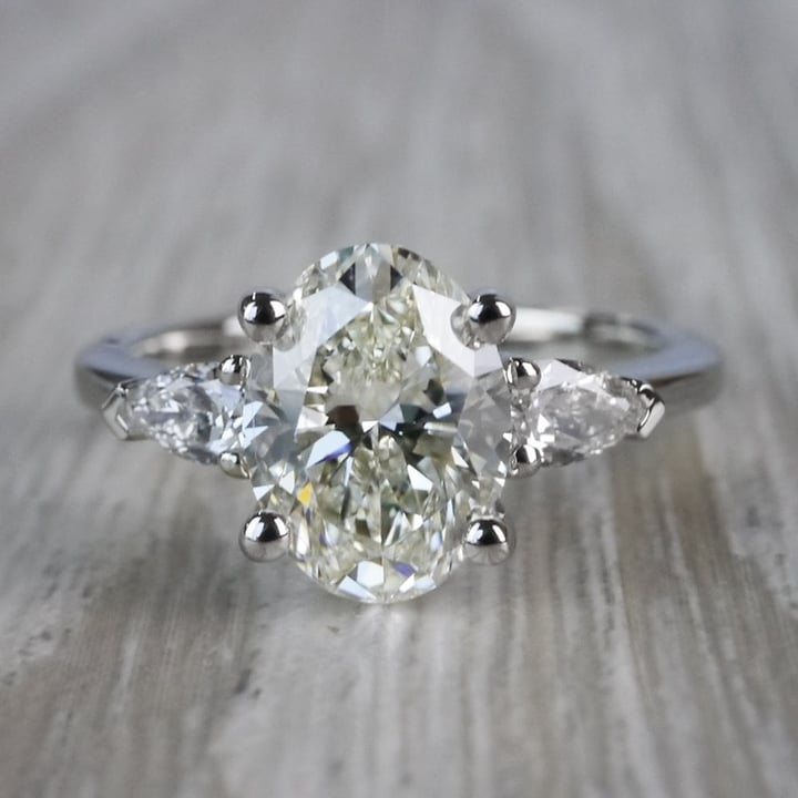Outstanding Oval Diamond & Pear Cut Diamond Ring - small