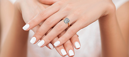 woman wearing a radiant cut diamond ring