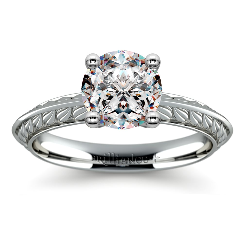 https://www.brilliance.com/sites/default/files/engagement-rings/antique-floral-knife-edge-solitaire-ring-platinum/antique-floral-knife-edge-solitaire-engagement-ring-platinum-1.jpg