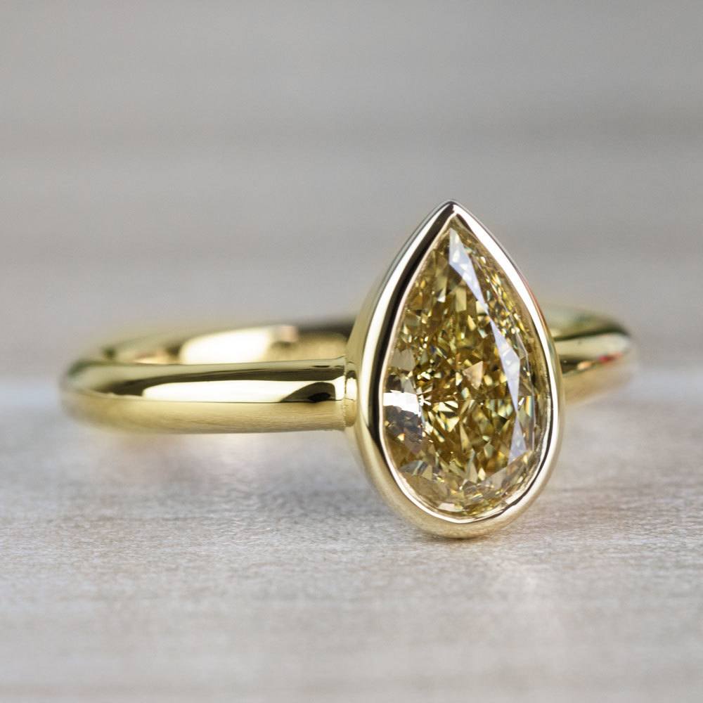1.25 Carat Fancy Yellow Pear Diamond Bezel Solitaire Engagement Ring