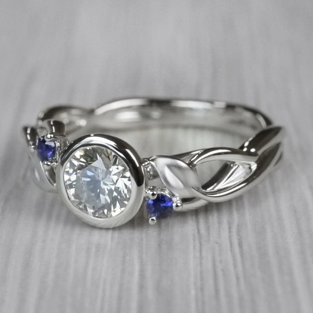 Bezel Set Diamond Ring With Leaf Side Stones